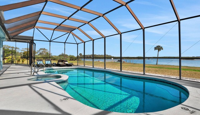 Sprawling intercoastal home with boat lifts, pool and hot tub