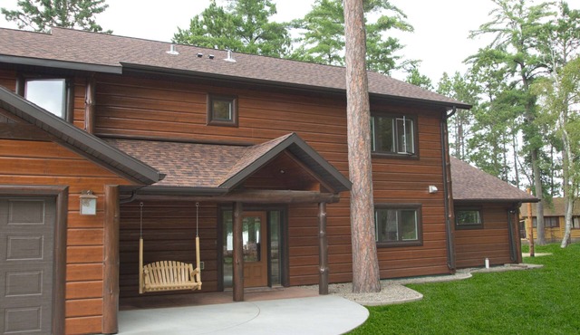 Spruce with two story high windows with loft on the premier lake of Big Sand