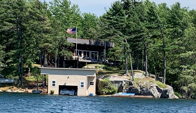 St. Lawrence River Cottage with 107 ft of river frontage and a boathouse