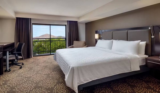 Standard King at Holiday Inn & Suites Airport North - Pool and Outdoor Dining
