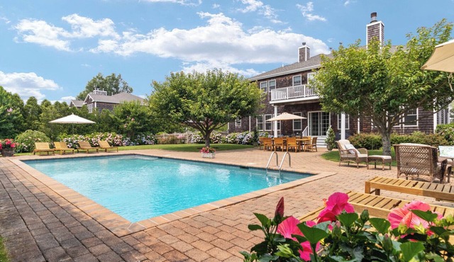 Stately traditional home with open floorplan and private pool in coveted.