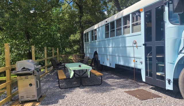 Stationary renovated local school bus. Inquire about our hunter specials!