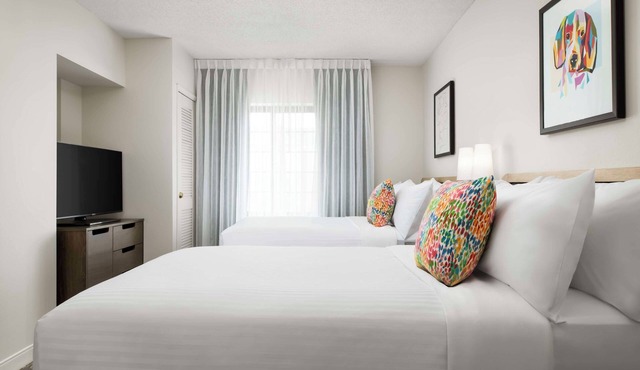 Stay Comfortably in a Pet-Friendly Suite with Swimming Pool Near Attractions