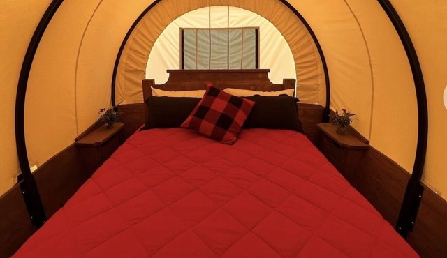 Stay in a unique Conestoga Wagon with room for 4