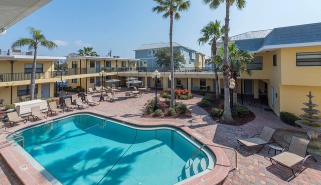 Steps to Beach, King Bed, Grill, Parking, Near Shops & Dining. +Tickets to Top Attractions Daily