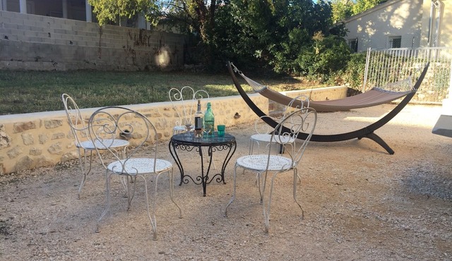Stone bastide with garden in the center of the village and next to the river