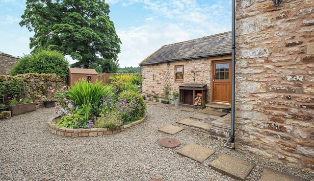 Stone built barn conversion with cosy living spaces and stunning fell views.