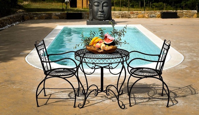 Stone farmhouse with pool.