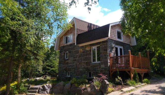 Stone House and outdoor living space on 6 acers of landscaped garden.