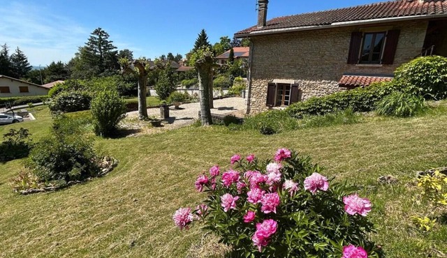 Stone house on the heights of Ambérieu. View of the Bugey mountains