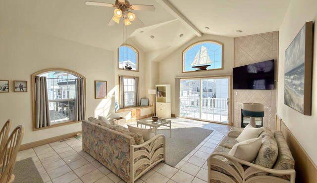 Stone’s Throw to the Beach! Duel Primary Suites Featured. Has 4 Decks! 3.5 Baths