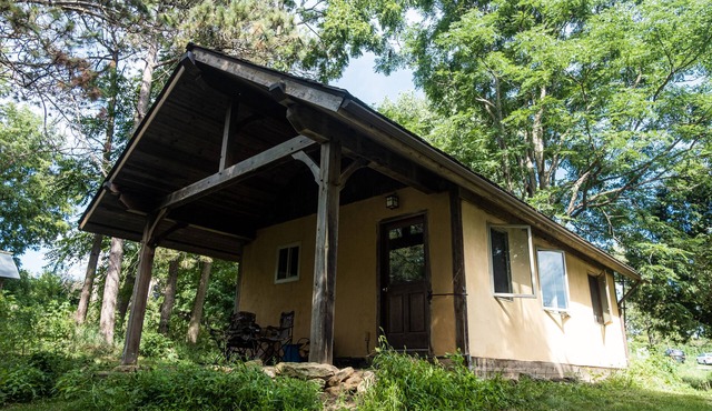 Straw clay sauna house on organic farm
