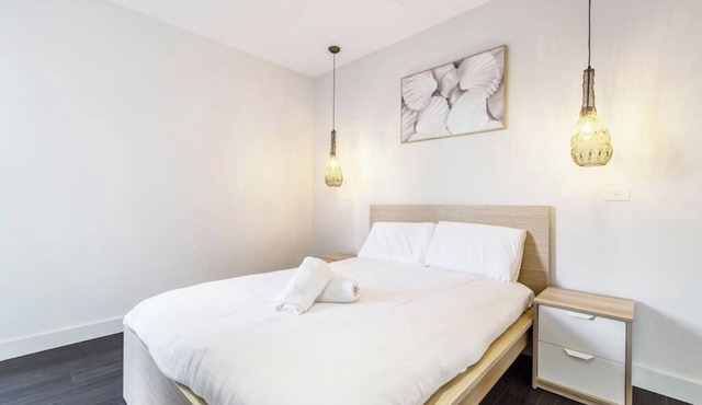 Stroll to the beach + Indoor Parking!