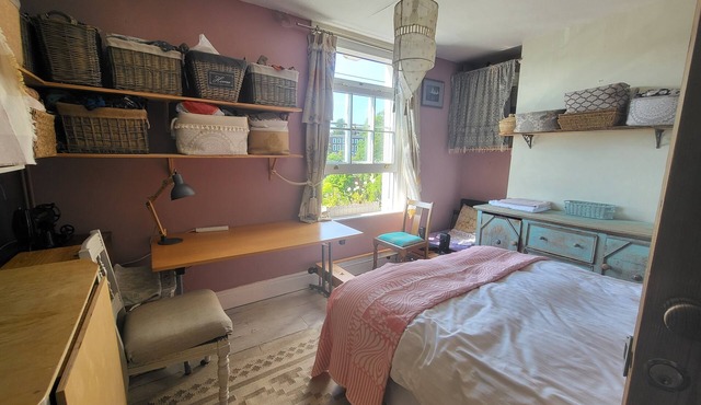 Study or holiday. Close to city, quiet, with trees and river view to the west.