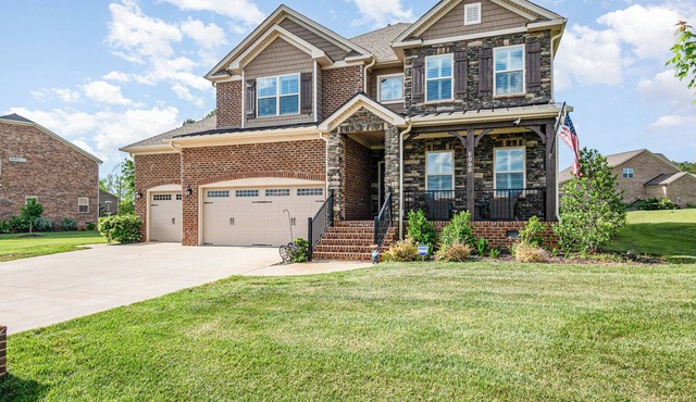 Stunning 4-bedroom spacious home with backyard and security in private community