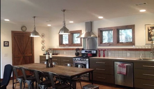 Stunning and private mid-century modern inspired cottage nestled in the woods.