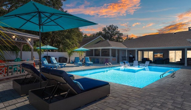 Stunning beach retreat with backyard oasis + heated pool!