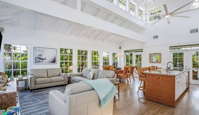 Stunning canal-front home with pools, AC, W/D & hammock