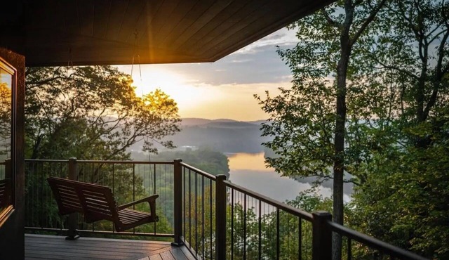 Stunning cliffside river view on private 60 acre forested retreat