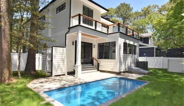 Stunning contemporary home with a private pool and walking distance to the beach