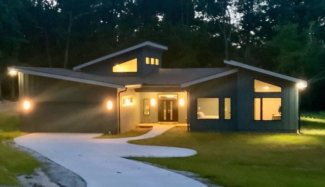 Stunning contemporary home in the woods; sauna, screened porch, soaring ceilings
