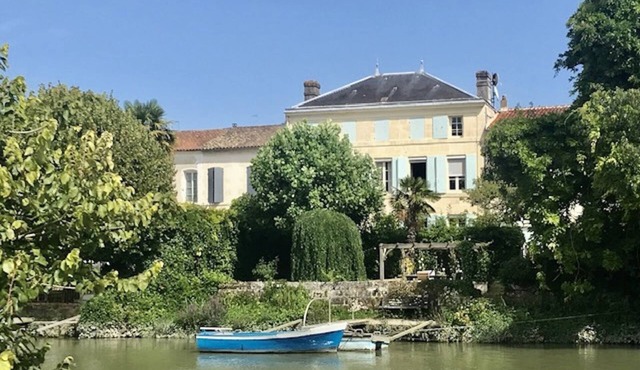 Stunning french townhouse with river frontage and private pool.