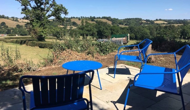 Stunning home with stunning lake and valley views and rolling hills.