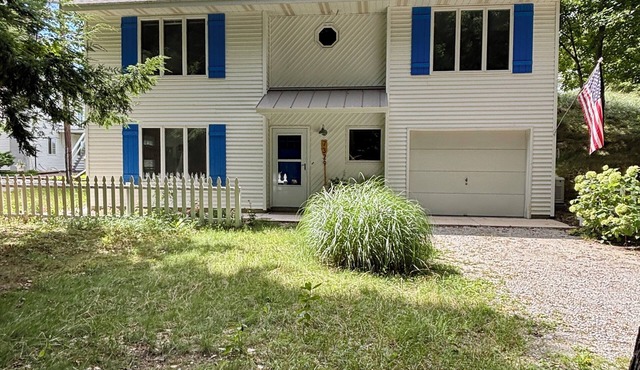 Stunning Lake Michigan Views with 110 Feet Private Beach on One Acre.