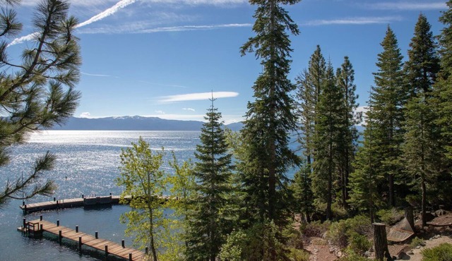 Stunning Lakefront Estate 4 acres with private pool beach piers and buoys. Incredible views!