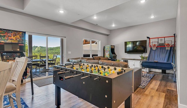 Stunning Lakefront Stay with Golf Cart, Private Hot Tub, Packed Game Room & Free Tickets Included!