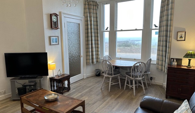 Stunning location - beachfront ground floor flat with private parking. Fab views