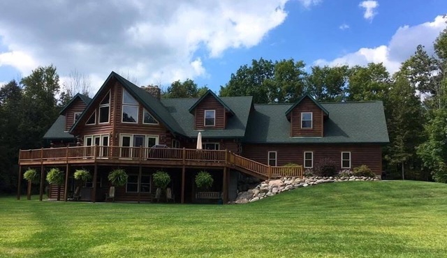 Stunning Log Cabin on 65 Acres with a new swimming pool
