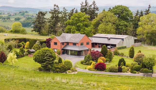 Stunning modern farmhouse retreat perched on a private hilltop in North Wales