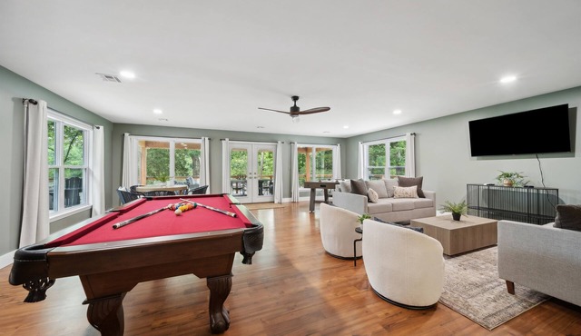 Stunning modern lakefront home, boat slip, pool table, huge deck & more!