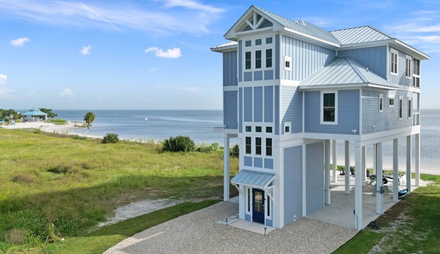 Stunning new beach house right on the sand, with use of private boat dock.