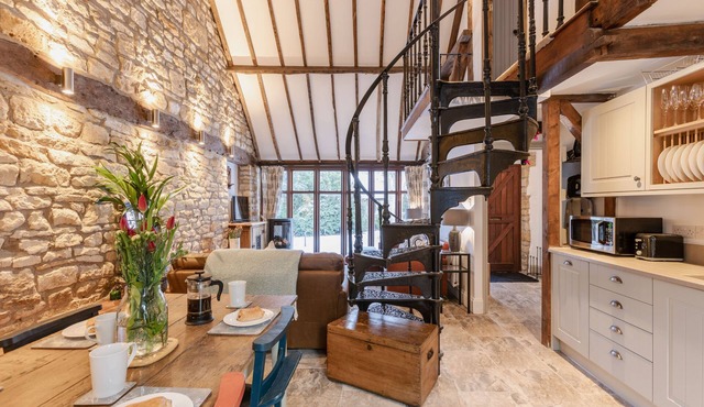 Stunning open plan 2 storey barn conversion with spiral staircase.