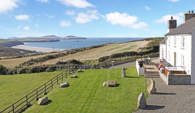 Stunning sea views, idyllic characterful farmhouse with log burner and jacuzzi