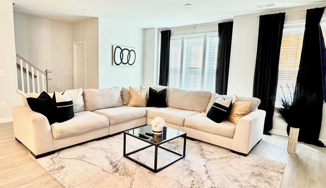 Stylish 4BR/2.5BA home for up to 10 guests with kitchen, patio, and workspace.