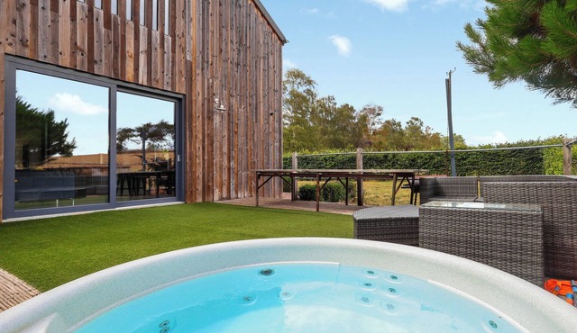 Stylish barn with hot tub, games room and countryside views.