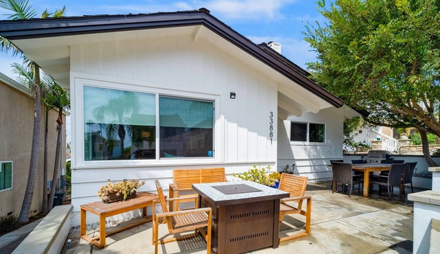 Stylish beach home near everything with large patio & enclosed yard w/fire pit
