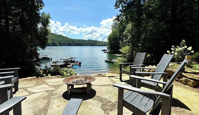 Stylish lakefront home with large flat yard, boat dock, hot tub & mountain view!