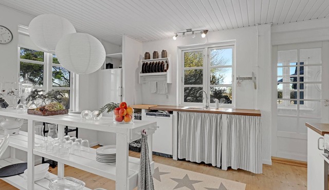 Stylish living in this large vacation home in Østermarie on the island of Bornholm.