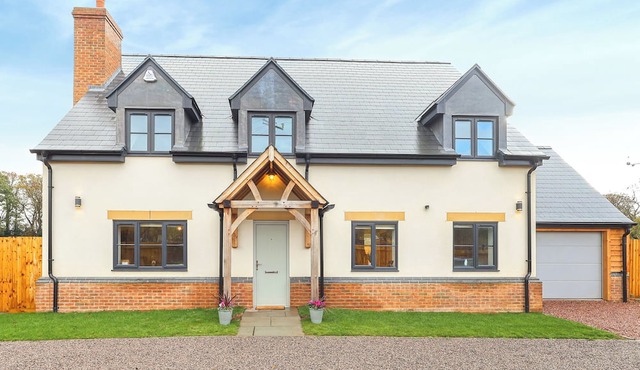 Stylish modern home with games room, luxury kitchen and two en suite bedrooms.