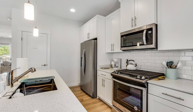 Stylish, two-story home with a washer/dryer & furnished porch - dogs welcome