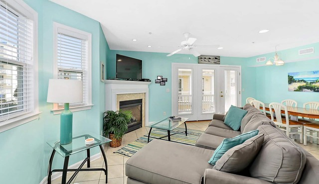 Stylish, upscale 3 bedroom condo with a television in every bedroom and living room, free WiFi, and two floors located downtown only a few streets from the boardwalk and only steps to the beach!