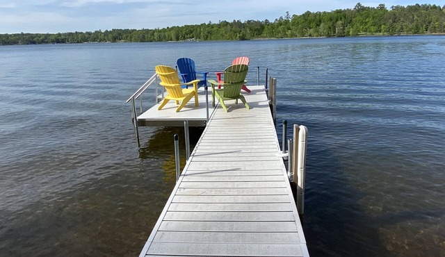 SUMMER fun in a cozy log lake home on the Whitefish Chain under the tall pines