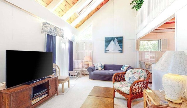 Summer home with expansive deck & wonderful location for beachgoers
