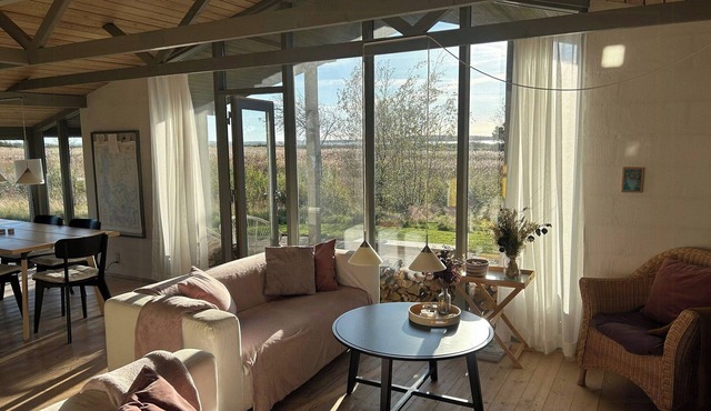 Summer house with fields and fjord views