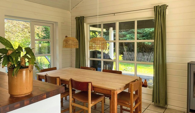 Summer house with path to pier by fjord