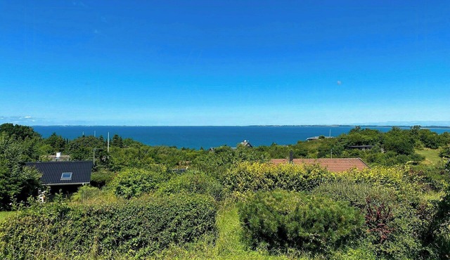 Summer house with sunset over Sejerø Bay